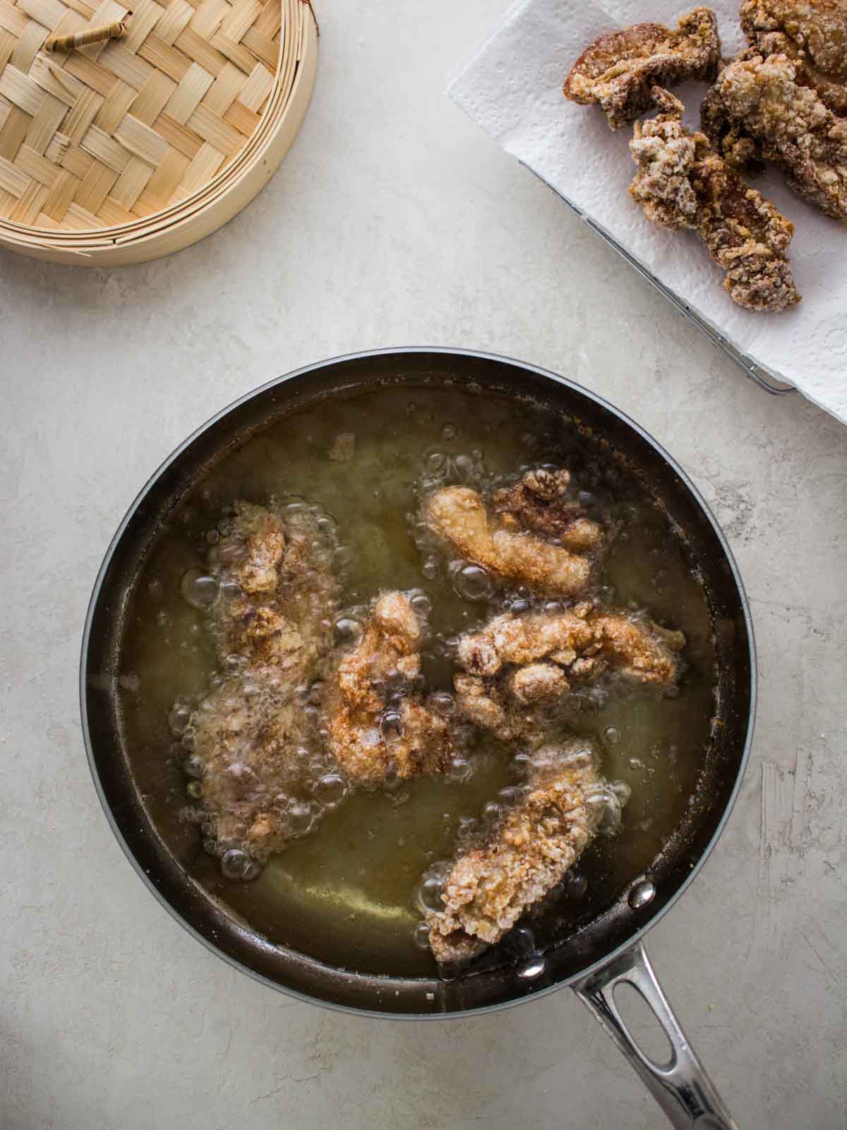 chicken frying in oil
