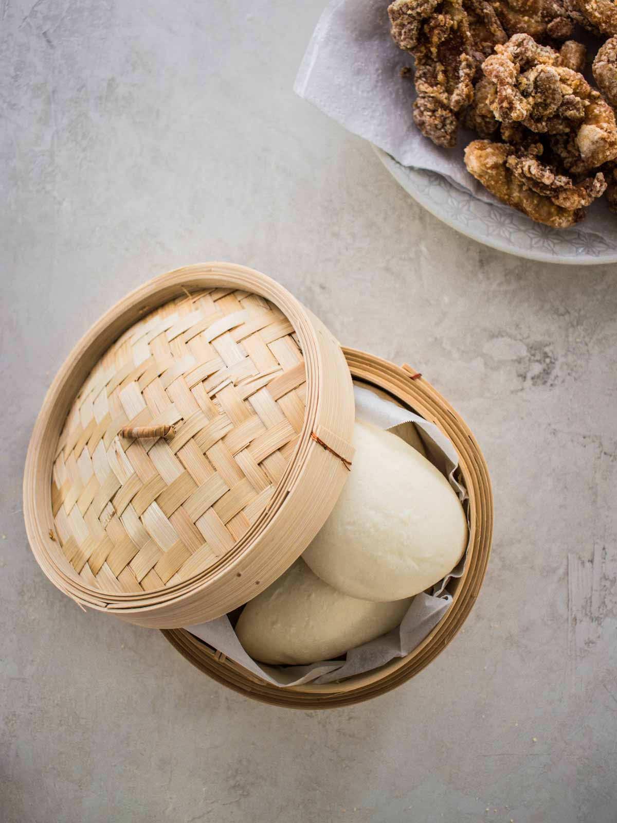 boa buns in a bamboo steamer