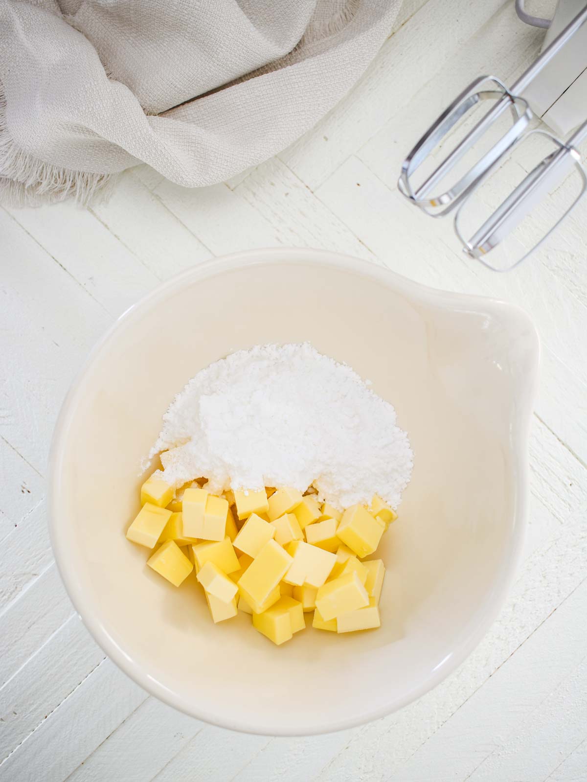 Butter and powdered sugar in a bowl