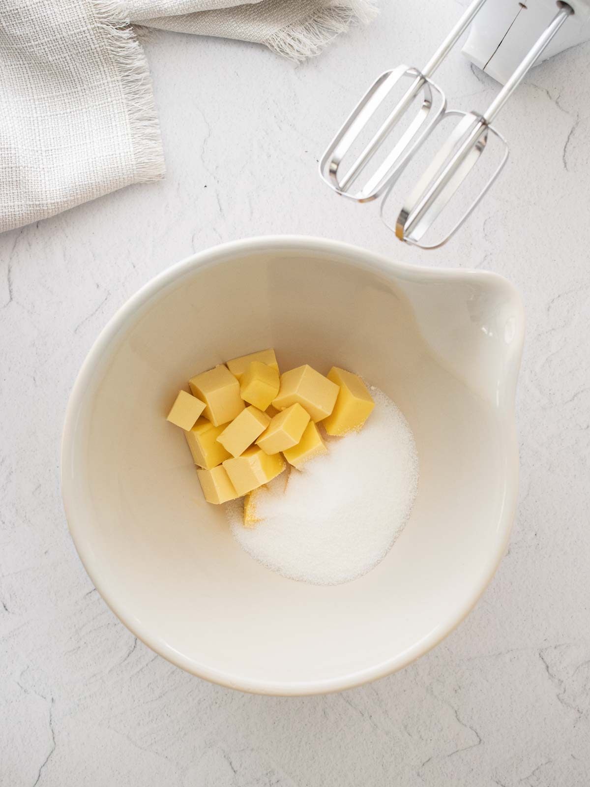 Butter and sugar in a bowl