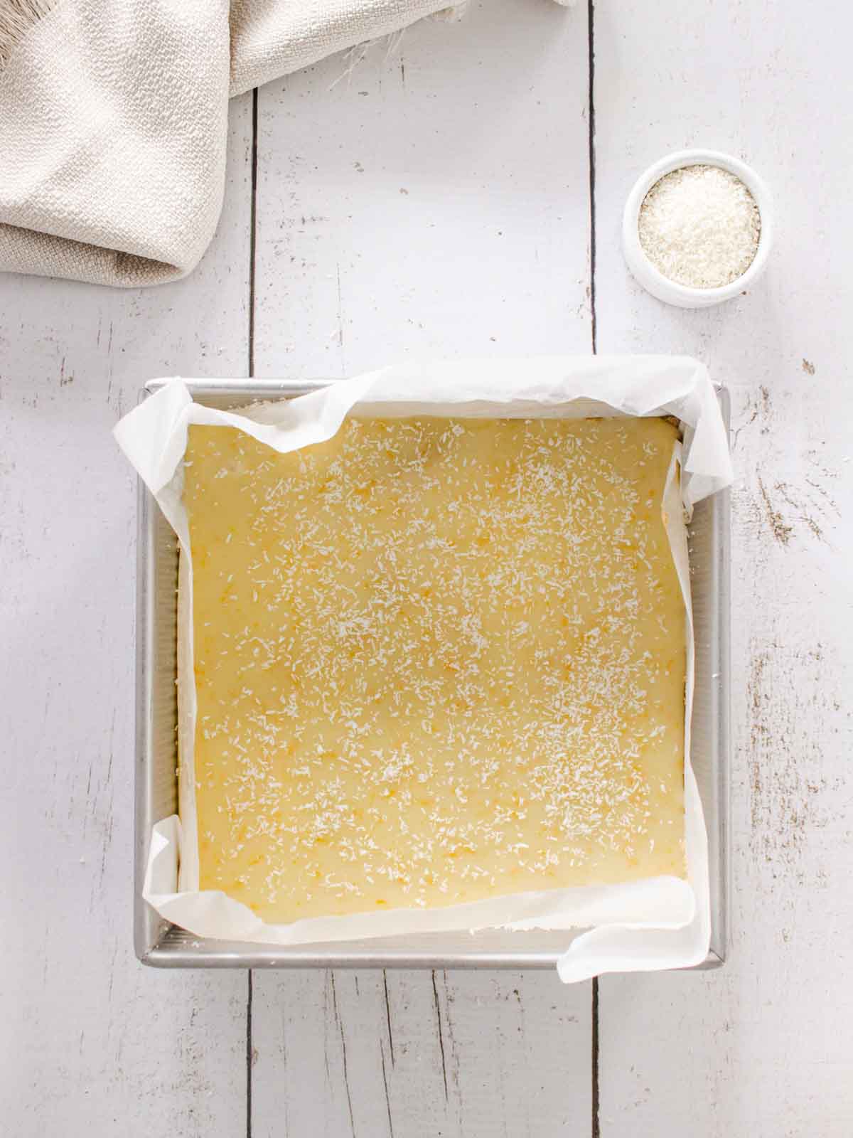 Desiccated coconut sprinkled over lemon slice