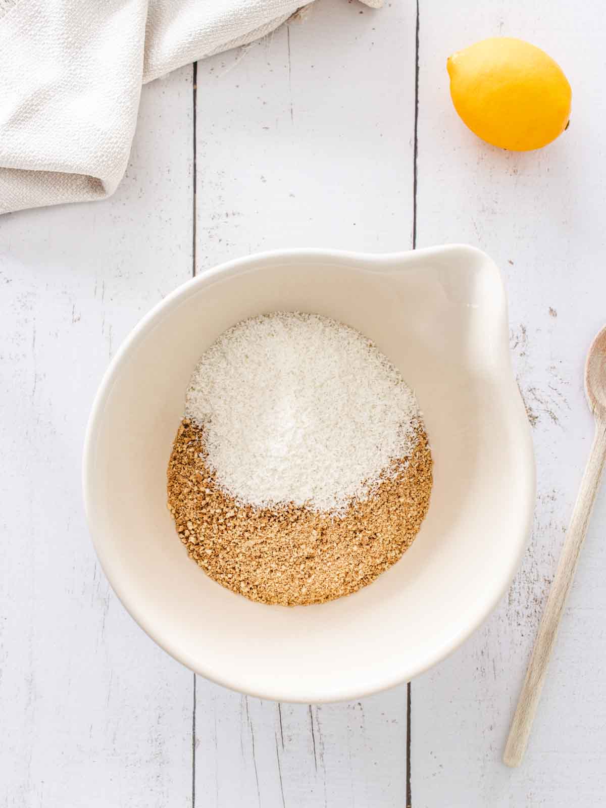 crushed biscuits and desiccated coconut in a bowl